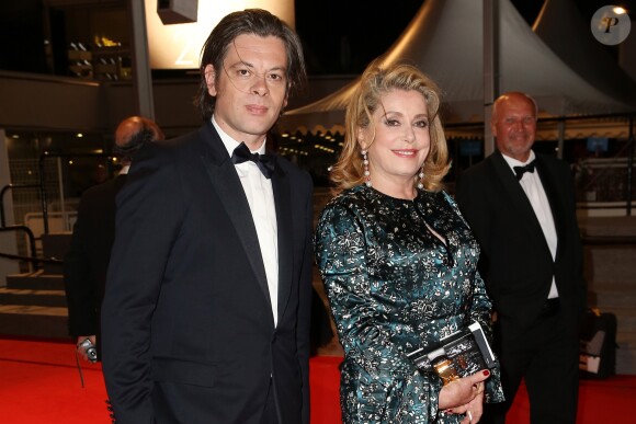 Benjamin Biolay et Catherine Deneuve - Descente des marches du film "L'homme qu'on aimait trop" lors du 67 ème Festival du film de Cannes – Cannes le 21 mai 2014.