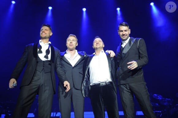 Keith Duffy, Ronan Keating, Mikey Graham, Shane Lynch - Le groupe Boyzone en concert au Wembley Arena a Londres, le 21 decembre 2013.