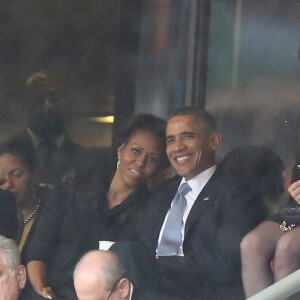 Michelle et Barack Obama - Personnalites a la ceremonie d'hommage officielle a Nelson Mandela au stade de Soccer City a Soweto. Le 10 decembre 2013 SOUTH AFRICA, Johannesburg : people for the memorial service of South African former president Nelson Mandela at the FNB Stadium (Soccer City) in Johannesburg on December 10, 2013. Mandela, the revered icon of the anti-apartheid struggle in South Africa and one of the towering political figures of the 20th century, died in Johannesburg on December 5 at age 9510/12/2013 - Soweto