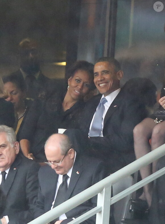 Michelle et Barack Obama - Personnalites a la ceremonie d'hommage officielle a Nelson Mandela au stade de Soccer City a Soweto. Le 10 decembre 2013 SOUTH AFRICA, Johannesburg : people for the memorial service of South African former president Nelson Mandela at the FNB Stadium (Soccer City) in Johannesburg on December 10, 2013. Mandela, the revered icon of the anti-apartheid struggle in South Africa and one of the towering political figures of the 20th century, died in Johannesburg on December 5 at age 9510/12/2013 - Soweto