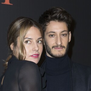 Pierre Niney et sa compagne Natasha Andrews  - People au défilé de mode "Dior Homme", collection Hommes Automne-Hiver 2017/2018 au Grand Palais à Paris. Le 21 janvier 2017 © Olivier Borde / Bestimage