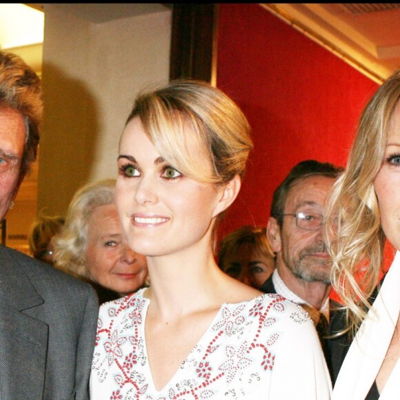 Johnny et Laeticia Hallyday avec Estelle Lefébure à Paris en 2005