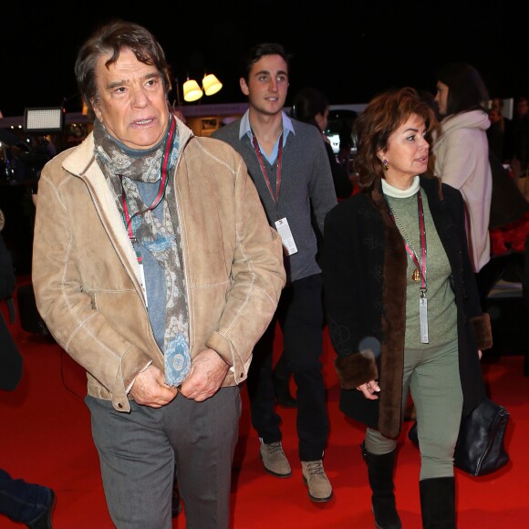 Bernard Tapie avec sa femme Dominique au Gucci Paris Masters, à Villepinte le 7 décembre 2013.