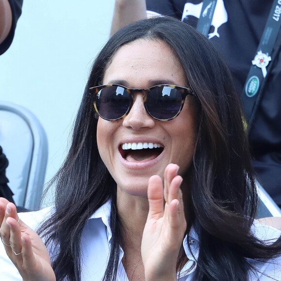 Première apparition officielle du prince Harry et sa compagne Meghan Markle dans les tribunes de la finale de tennis à la troisième édition des Invictus Games à Toronto, Ontario, Canada, le 25 septembre 2017. 