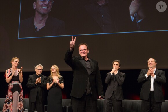 Quentin Tarantino devant Harvey Weinstein et Mélanie Laurent à Lyon, le 19 octobre 2013.