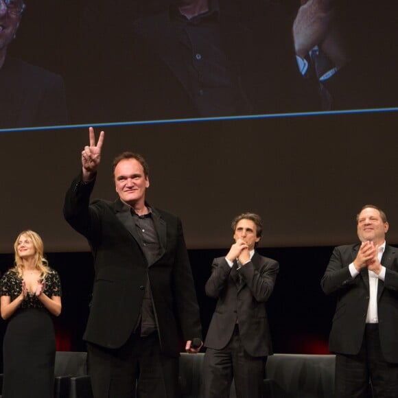 Quentin Tarantino devant Harvey Weinstein et Mélanie Laurent à Lyon, le 19 octobre 2013.