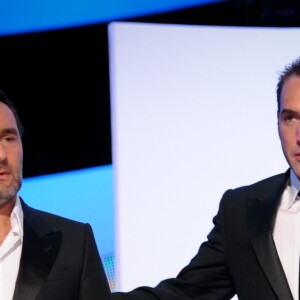 Gilles Lellouche, Guillaume Canet et Jean Dujardin à la 37e édition des César au Theâtre du Chatelet à Paris, le 24 février 2012
