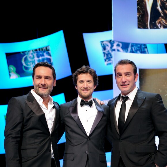 Gilles Lellouche, Guillaume Canet et Jean Dujardin à la 37e édition des César au Theâtre du Chatelet à Paris, le 24 février 2012