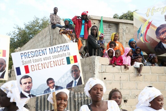 Illustration - Après avoir été accueillis par le Président de la République du Sénégal, Macky Sall et son épouse Marène Sall sur l'aéroport de Saint-Louis, le Président de la République française, Emmanuel Macron accompagné de son épouse Brigitte Macron ont participé à un bain de foule dans les rues de la ville. Ils se sont, ensuite, rendus sur la Langue de Barbarie, touchée par l'érosion côtière avant d'aller sur la place Faidherbe pour une allocution des deux chefs d'états. Avant de quitter Saint-Louis, le couple présidentiel est allé à la rencontre des élèves d'une école à l'occasion du lancement symbolique d'un concours sur les cent ans de l'Aéropostale. Saint-Louis, Sénégal le le 3 Février 2018. © Dominique Jacovides/Bestimage