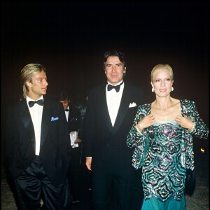 David Hallyday, Tony Scotti et Sylvie Vartan en 1985 lors de la soirée du lancement du parfum Poison de Dior.