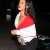 Exclusif - Rihanna arrive au restaurant 'Giorgio Baldi' à Santa Monica en Californie. Elle porte une jupe en jean noir, un haut blanc et rouge et une pochette Gucci, le 11 novembre 2017.