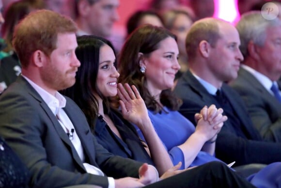 La duchesse Catherine de Cambridge, enceinte, et le prince William avec le prince Harry et Meghan Markle lors du premier forum de la Fondation royale, le 28 février 2018 à Londres.