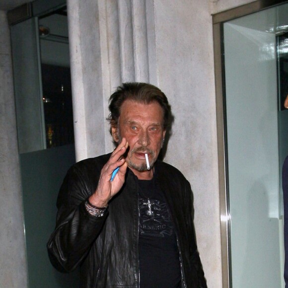 Johnny Hallyday et sa femme Laeticia sont allés dîner avec Christian Audigier et sa fiancée Nathalie Sorensen au restaurant Mr Chow à Los Angeles le 23 janvier 2015.23/01/2015 - Los Angeles