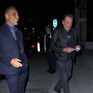 Johnny Hallyday et sa femme Laeticia sont allés dîner avec Christian Audigier et sa fiancée Nathalie Sorensen au restaurant Mr Chow à Los Angeles le 23 janvier 2015.23/01/2015 - Los Angeles