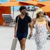 Exclusif - Eva Longoria, très enceinte, avec son mari José Baston sur une plage à Miami, le 26 mars 2018