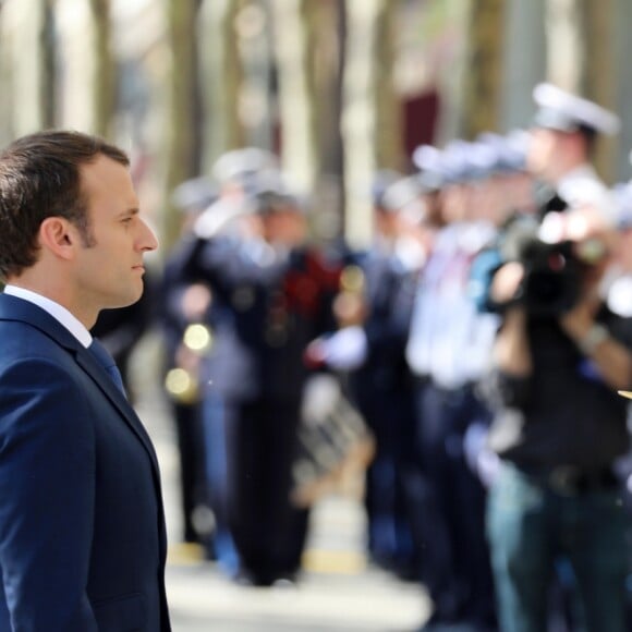 Le président de la République française Emmanuel Macron lors de l'hommage à Xavier Jugelé sur les Champs Elysées, à Paris le 20 avril 2018. Une plaque a été dévoilée. © Dominique Jacovides / Bestimage