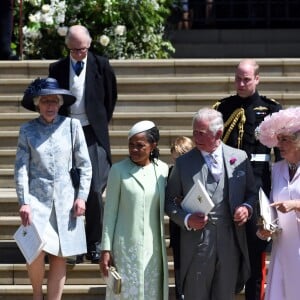 Le prince George de Cambridge, petit "pageboy" vêtu d'une réplique de l'uniforme des Blues and Royals porté par le prince Harry et le prince William, avec ses parents le duc et la duchesse de Cambridge à Windsor le 19 mai 2018 au mariage du prince Harry et de Meghan Markle.