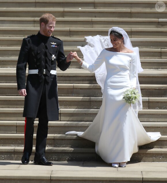 Le prince Harry, duc de Sussex, et Meghan Markle, duchesse de Sussex, à la sortie de chapelle St. George au château de Windsor - Sortie après la cérémonie de mariage du prince Harry et de Meghan Markle en la chapelle Saint-George au château de Windsor, Royaume Uni, le 19 mai 2018.