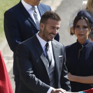 David Beckham et sa femme Victoria - Les invités arrivent à la chapelle St. George pour le mariage du prince Harry et de Meghan Markle au château de Windsor, Royaume Uni, le 19 mai 2018.