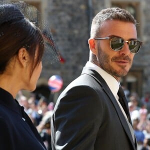 David Beckham et sa femme Victoria - Les invités arrivent à la chapelle St. George pour le mariage du prince Harry et de Meghan Markle au château de Windsor, Royaume Uni, le 19 mai 2018.