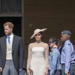 La duchesse Meghan de Sussex (Meghan Markle), vêtue d'une robe Goat, et le prince Harry prenaient part le 22 mai 2018 à une garden party organisée dans les jardins de Buckingham Palace dans le cadre des célébrations du 70e anniversaire du prince Charles. A cinq mois de la date (14 novembre 2018), le rassemblement honorait ses patronages, associations et rôles militaires.