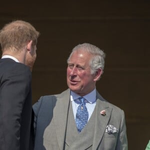 La duchesse Meghan de Sussex (Meghan Markle), vêtue d'une robe Goat, et le prince Harry prenaient part le 22 mai 2018 à une garden party organisée dans les jardins de Buckingham Palace dans le cadre des célébrations du 70e anniversaire du prince Charles. A cinq mois de la date (14 novembre 2018), le rassemblement honorait ses patronages, associations et rôles militaires.