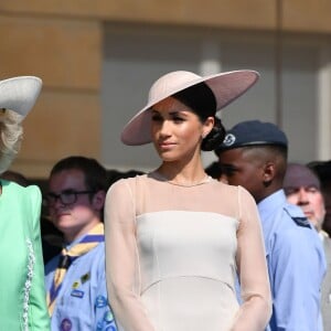 La duchesse Meghan de Sussex (Meghan Markle), vêtue d'une robe Goat, et le prince Harry prenaient part le 22 mai 2018 à une garden party organisée dans les jardins de Buckingham Palace dans le cadre des célébrations du 70e anniversaire du prince Charles. A cinq mois de la date (14 novembre 2018), le rassemblement honorait ses patronages, associations et rôles militaires.