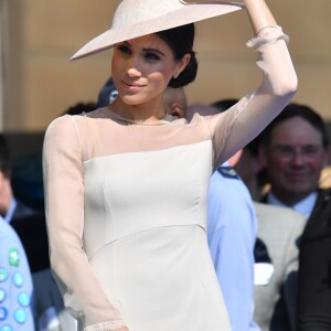 La duchesse Meghan de Sussex (Meghan Markle), vêtue d'une robe Goat, et le prince Harry prenaient part le 22 mai 2018 à une garden party organisée dans les jardins de Buckingham Palace dans le cadre des célébrations du 70e anniversaire du prince Charles. A cinq mois de la date (14 novembre 2018), le rassemblement honorait ses patronages, associations et rôles militaires.