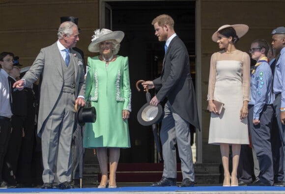 La duchesse Meghan de Sussex (Meghan Markle), en robe Goat, et le prince Harry prenaient part le 22 mai 2018 à une garden party organisée à Buckingham Palace dans le cadre des célébrations du 70e anniversaire du prince Charles. A cinq mois de la date (14 novembre 2018), le rassemblement honorait ses patronages, associations et rôles militaires.