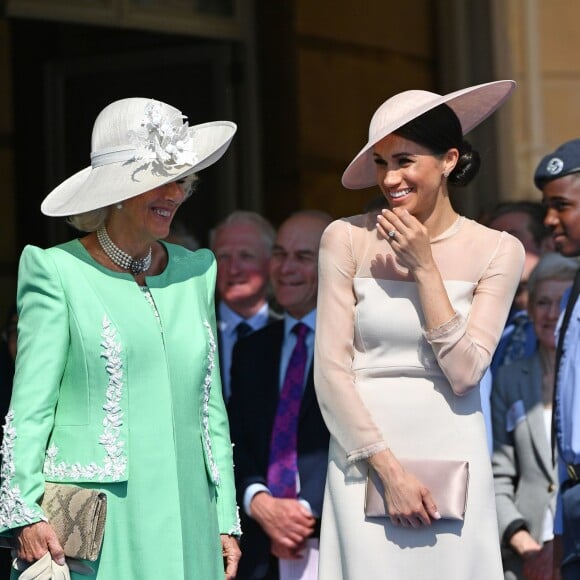 La duchesse Meghan de Sussex (Meghan Markle), vêtue d'une robe Goat, et le prince Harry prenaient part le 22 mai 2018 à une garden party organisée dans les jardins de Buckingham Palace dans le cadre des célébrations du 70e anniversaire du prince Charles. A cinq mois de la date (14 novembre 2018), le rassemblement honorait ses patronages, associations et rôles militaires.