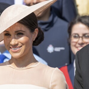 La duchesse Meghan de Sussex (Meghan Markle), vêtue d'une robe Goat, et le prince Harry prenaient part le 22 mai 2018 à une garden party organisée dans les jardins de Buckingham Palace dans le cadre des célébrations du 70e anniversaire du prince Charles. A cinq mois de la date (14 novembre 2018), le rassemblement honorait ses patronages, associations et rôles militaires.