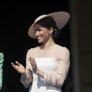 La duchesse Meghan de Sussex (Meghan Markle), vêtue d'une robe Goat, et le prince Harry prenaient part le 22 mai 2018 à une garden party organisée dans les jardins de Buckingham Palace dans le cadre des célébrations du 70e anniversaire du prince Charles. A cinq mois de la date (14 novembre 2018), le rassemblement honorait ses patronages, associations et rôles militaires.