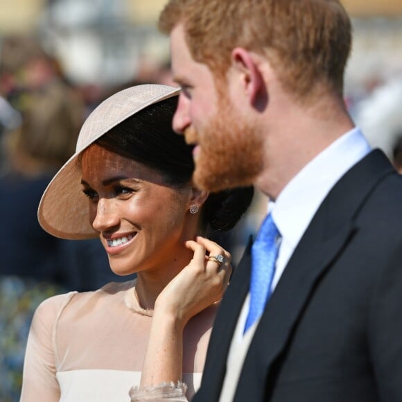 Le prince Harry, duc de Sussex, et Meghan Markle, duchesse de Sussex, lors de la garden party pour les 70 ans du prince Charles au palais de Buckingham à Londres. Le 22 mai 2018.