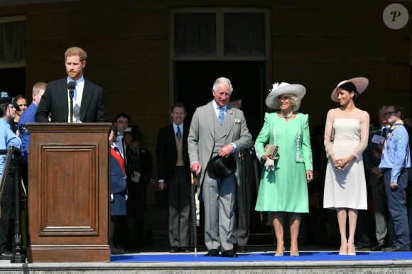 Camilla Parker Bowles, duchesse de Cornouailles, le prince Harry, duc de Sussex, et Meghan Markle, duchesse de Sussex, lors de la garden party pour les 70 ans du prince Charles au palais de Buckingham à Londres. Le 22 mai 2018.
