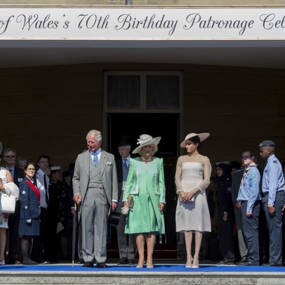 Le prince Harry, duc de Sussex, le prince Charles, prince de Galles, Camilla Parker Bowles, duchesse de Cornouailles, Meghan Markle, duchesse de Sussex lors de la garden party pour les 70 ans du prince Charles au palais de Buckingham à Londres. Le 22 mai 2018.