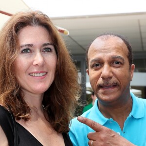 Pascal Legitimus et sa femme Adriana Santini au village lors des internationaux de tennis de Roland Garros, à Paris le 28 mai 2018.