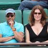 Pascal Legitimus et sa femme Adriana Santini en tribune lors des internationaux de tennis de Roland Garros le 28 mai 2018.