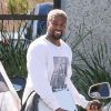 Exclusif - Kanye West arrive, tout sourire dans ses studios d'enregistrement à Calabasas le 20 avril 2018.