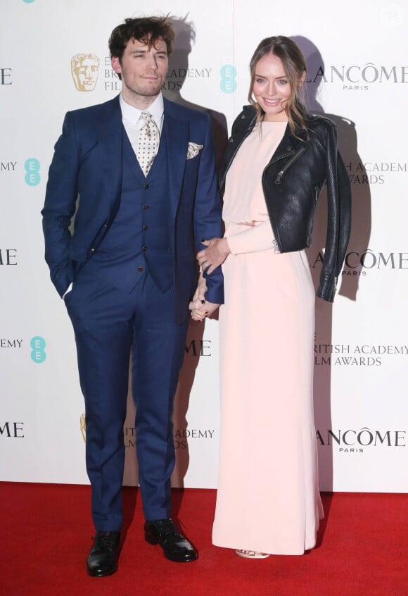 Sam Claflin et sa femme Laura Haddock - Photocall de la soirée "Pre BAFTA Lancôme" à Londres. Le 13 février 2016