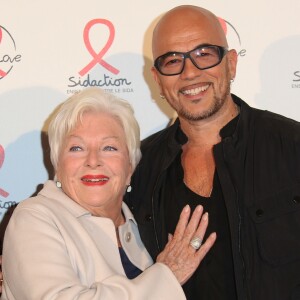 Line Renaud et Pascal Obispo lors du photocall du lancement de l'album des 20 ans de Sidaction à l'Elysée Biarritz, à Paris le 22 octobre 2014.