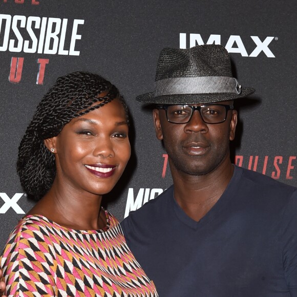 Lilian Thuram et sa compagne Kareen Guiock au photocall lors de l'avant-première mondiale de "Mission: Impossible Fallout" au Palais de Chaillot à Paris, le 12 juillet 2018. © Giancarlo Gorassini/Bestimage