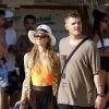 Paris Hilton et son compagnon Chris Zylka font du jet ski au large de Mykonos en Grèce, le 10 juillet 2018.