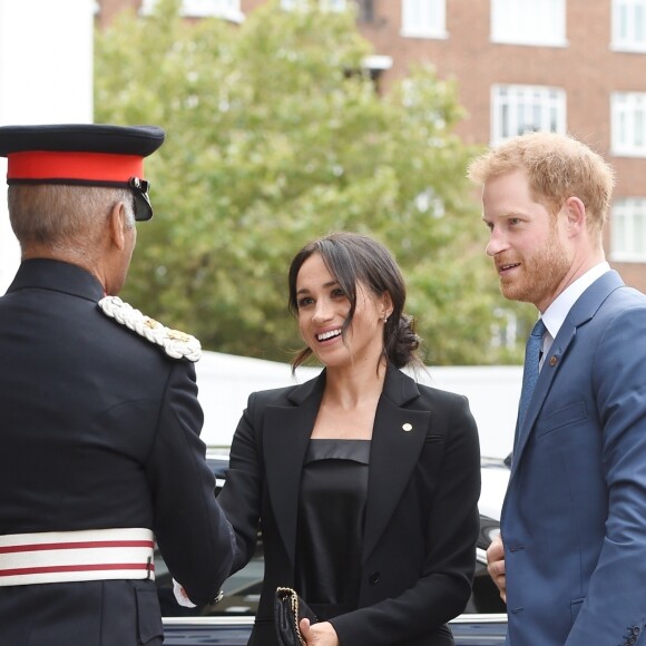 Le prince Harry, duc de Sussex, et Meghan Markle, duchesse de Sussex (en combinaison Altuzarra), arrivant à l'hôtel Royal Dorchester pour la cérémonie annuelle des WellChild Awards à Londres le 4 septembre 2018.