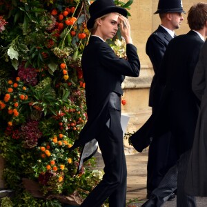 Cara Delevingne en Emporio Armani - Sorties après la cérémonie de mariage de la princesse Eugenie d'York et Jack Brooksbank en la chapelle Saint-George au château de Windsor, Royaume Uni, le 12 octobre 2018.