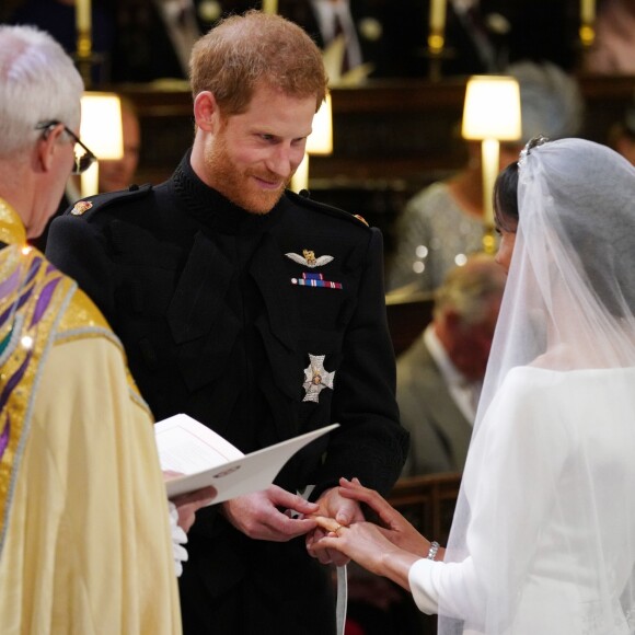 Le prince Harry et Meghan Markle, duc et duchesse de Sussex, échangeant les alliances lors de leur mariage le 19 mai 2018 en la chapelle St George à Windsor. Une cérémonie marquée notamment par leur émouvante complicité amoureuse, qui sautait aux yeux...