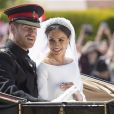 Le prince Harry, duc de Sussex, et Meghan Markle, duchesse de Sussex, en calèche à la sortie du château de Windsor après leur mariage le 19 mai 2018