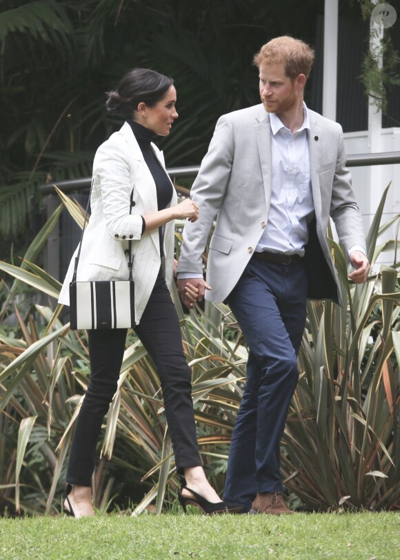 Le prince Harry, duc de Sussex, et Meghan Markle, duchesse de Sussex, enceinte, se rendent au "Domain", un espace ouvert de 34 hectares à Sydney, le 21 octobre 2018.