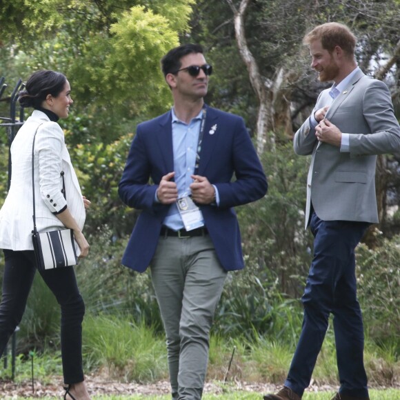 Le prince Harry, duc de Sussex, et Meghan Markle, duchesse de Sussex, enceinte, se rendent au "Domain", un espace ouvert de 34 hectares à Sydney, le 21 octobre 2018.