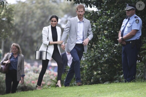 Le prince Harry, duc de Sussex, et Meghan Markle, duchesse de Sussex, enceinte, se rendent au "Domain", un espace ouvert de 34 hectares à Sydney, le 21 octobre 2018.