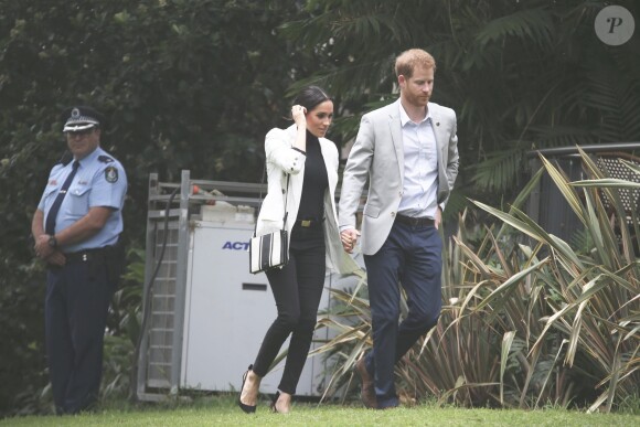Le prince Harry, duc de Sussex, et Meghan Markle, duchesse de Sussex, enceinte, se rendent au "Domain", un espace ouvert de 34 hectares à Sydney, le 21 octobre 2018.